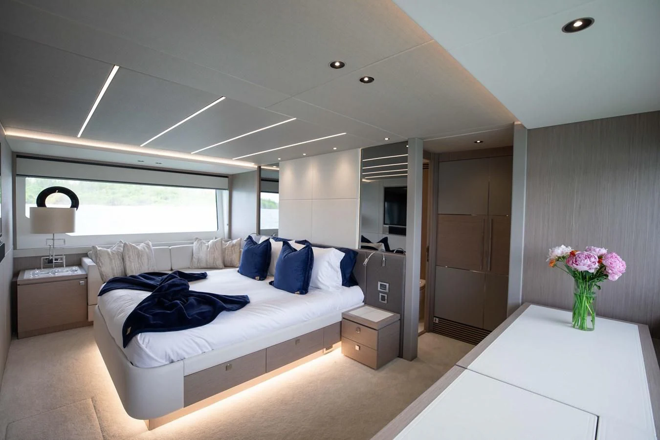 a bedroom with a bed and a desk aboard MILAMO Yacht for Sale