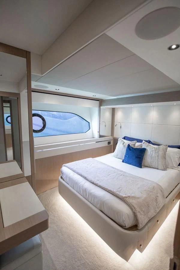 a bedroom with a large bed aboard MILAMO Yacht for Sale