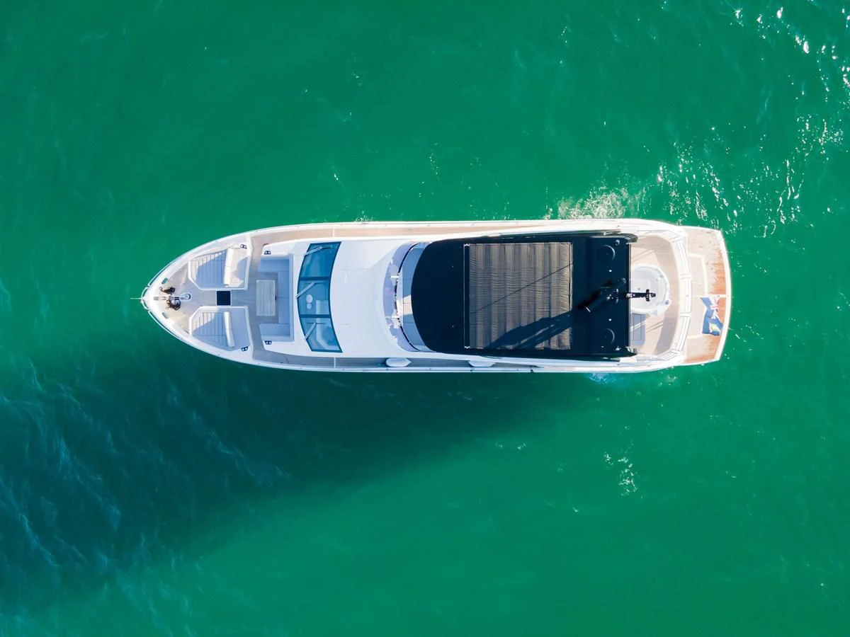 a white boat in the water aboard MILAMO Yacht for Sale