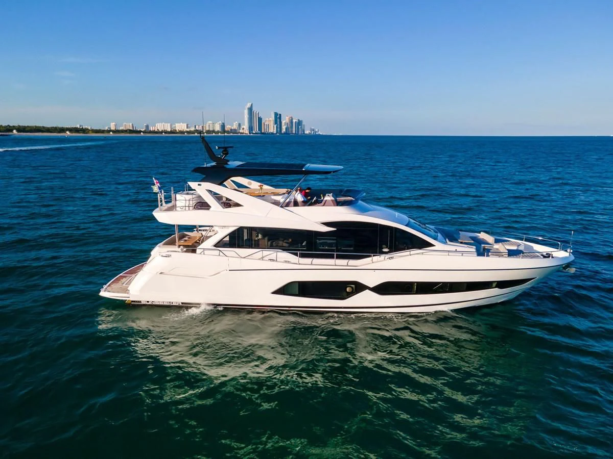 a white boat in the water aboard MILAMO Yacht for Sale