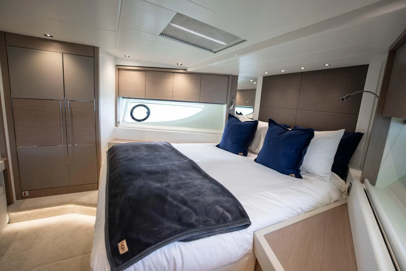 a room with a bed and a window aboard MILAMO Yacht for Sale
