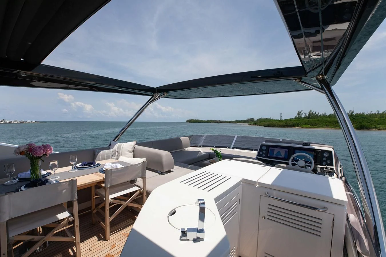 a boat with a table and chairs aboard MILAMO Yacht for Sale