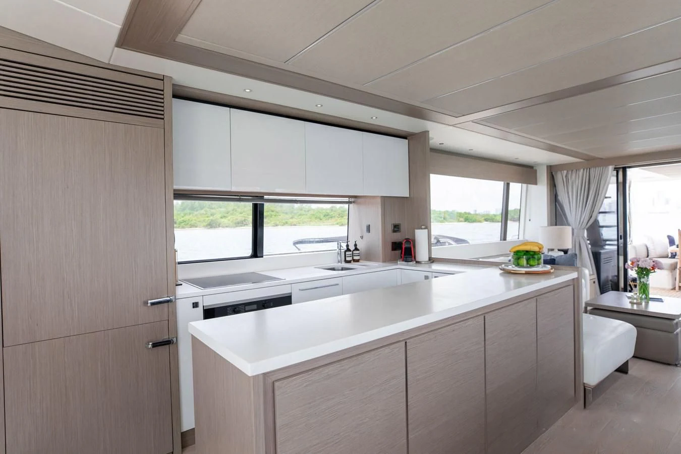 a kitchen with white cabinets aboard MILAMO Yacht for Sale