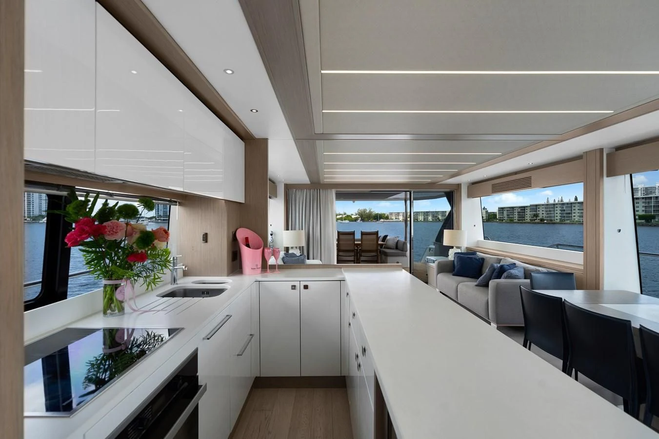a kitchen with a table and chairs aboard MILAMO Yacht for Sale