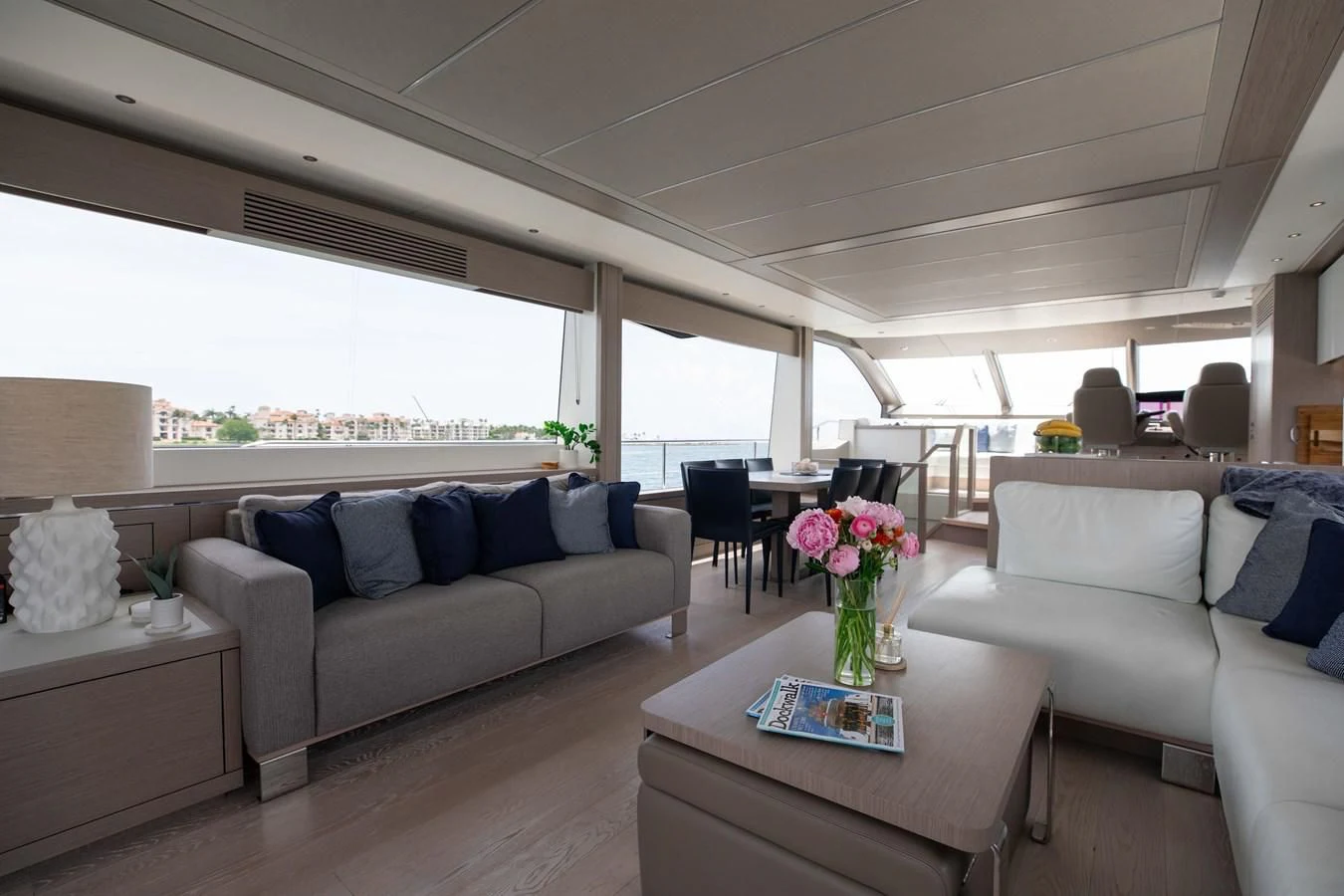 a living room with a couch and a table aboard MILAMO Yacht for Sale