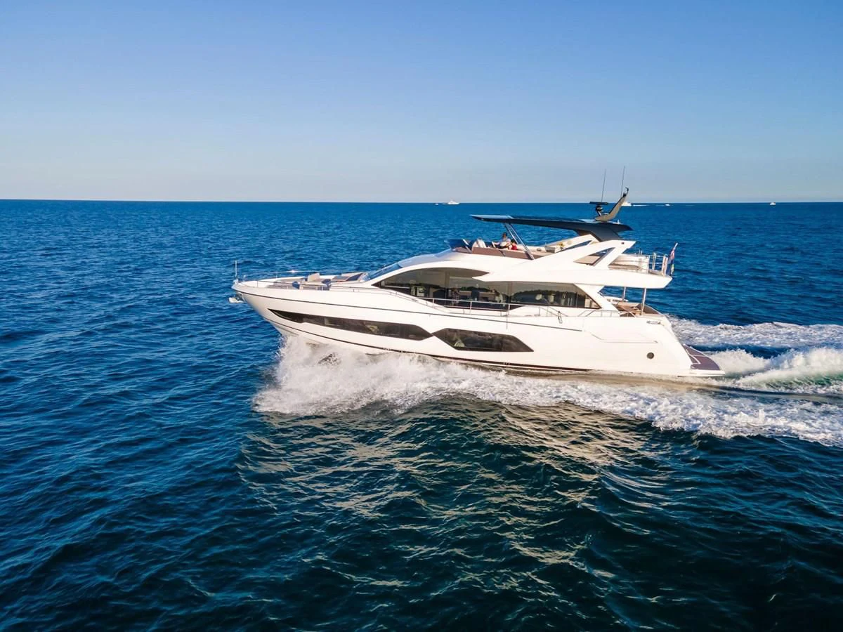 a white boat in the water aboard MILAMO Yacht for Sale