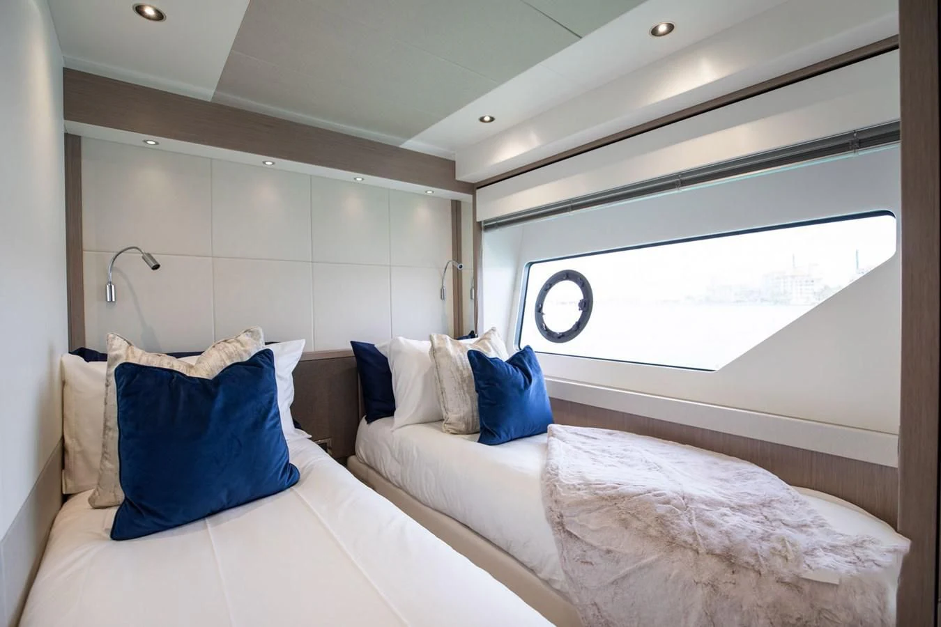 a room with two beds aboard MILAMO Yacht for Sale