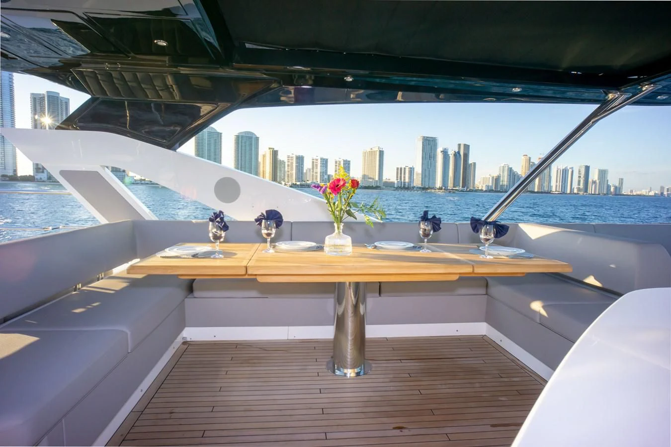 a table with flowers on it aboard MILAMO Yacht for Sale