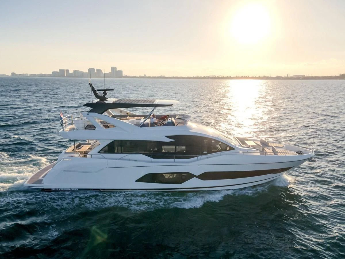 a white yacht in the water aboard MILAMO Yacht for Sale