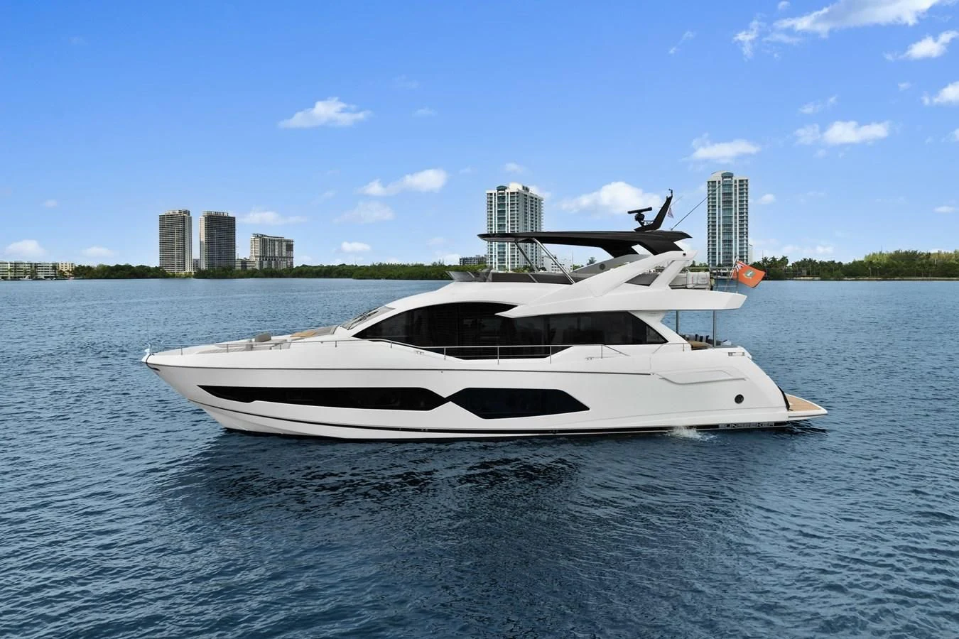 a white boat on the water aboard MILAMO Yacht for Sale