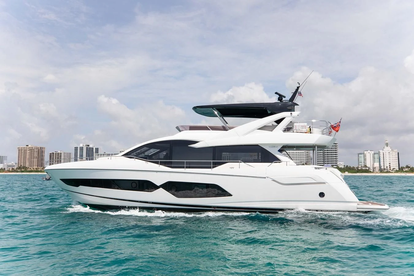 a white yacht in the water aboard MILAMO Yacht for Sale