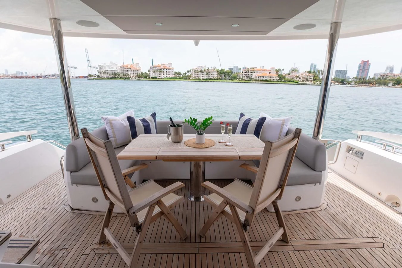 a table and chairs on a boat aboard MILAMO Yacht for Sale
