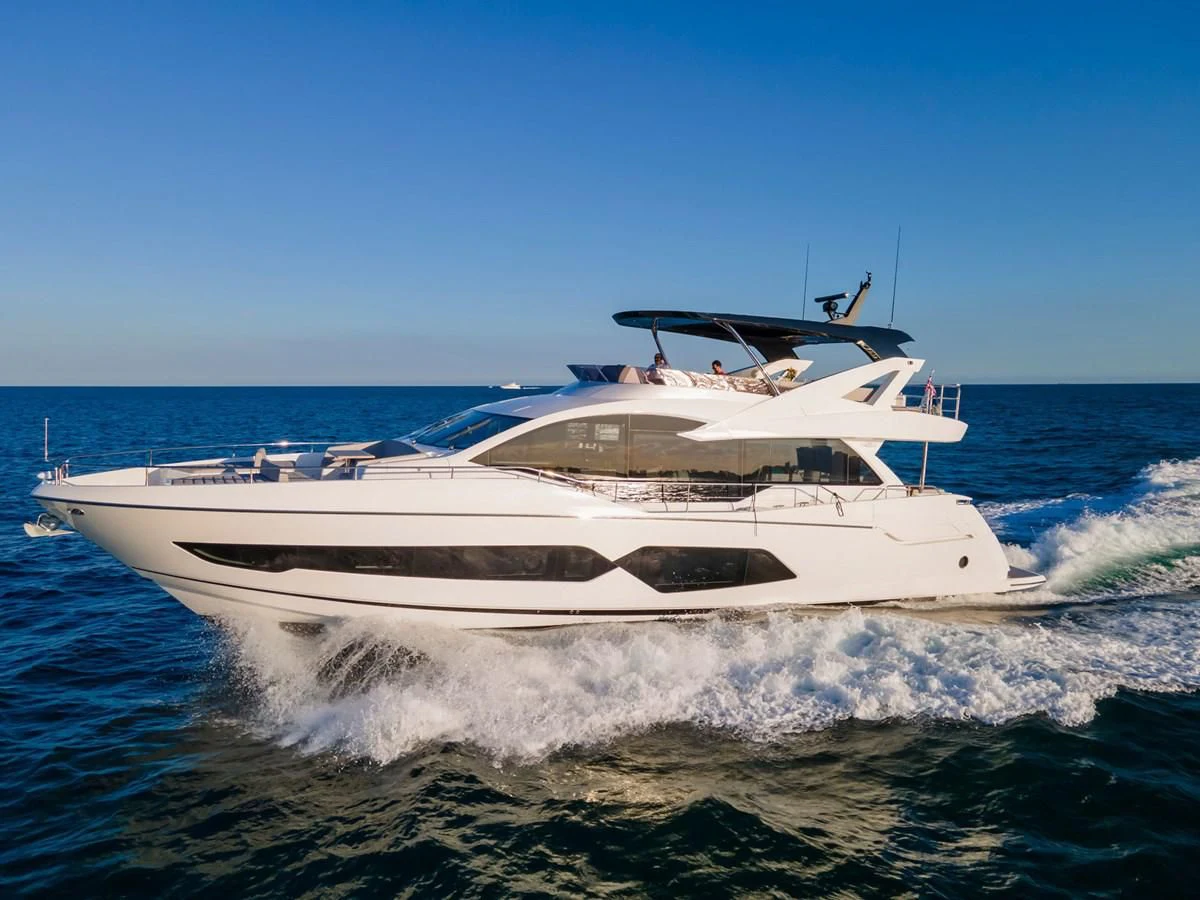 a white yacht on the water aboard MILAMO Yacht for Sale