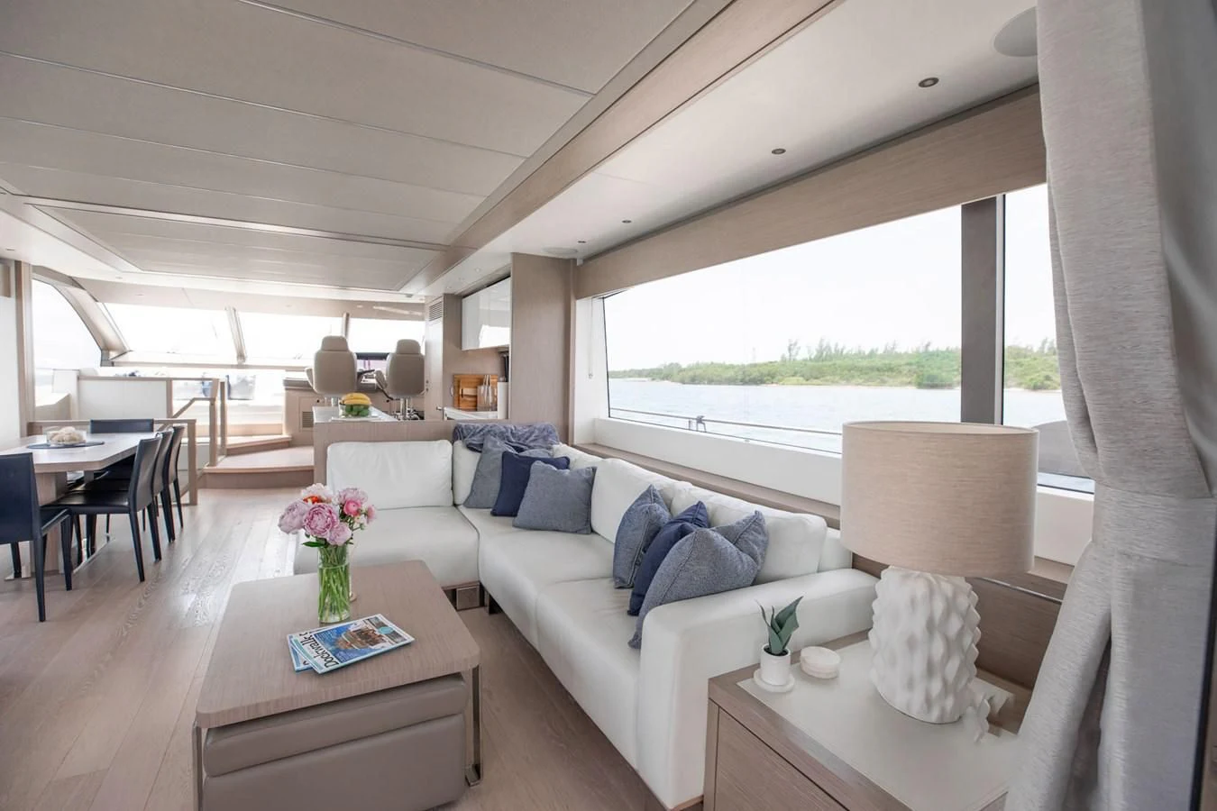 a living room with a couch and a table aboard MILAMO Yacht for Sale