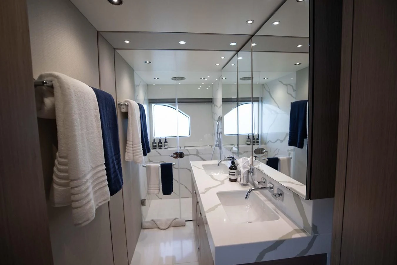 a bathroom with a sink and a mirror aboard MILAMO Yacht for Sale