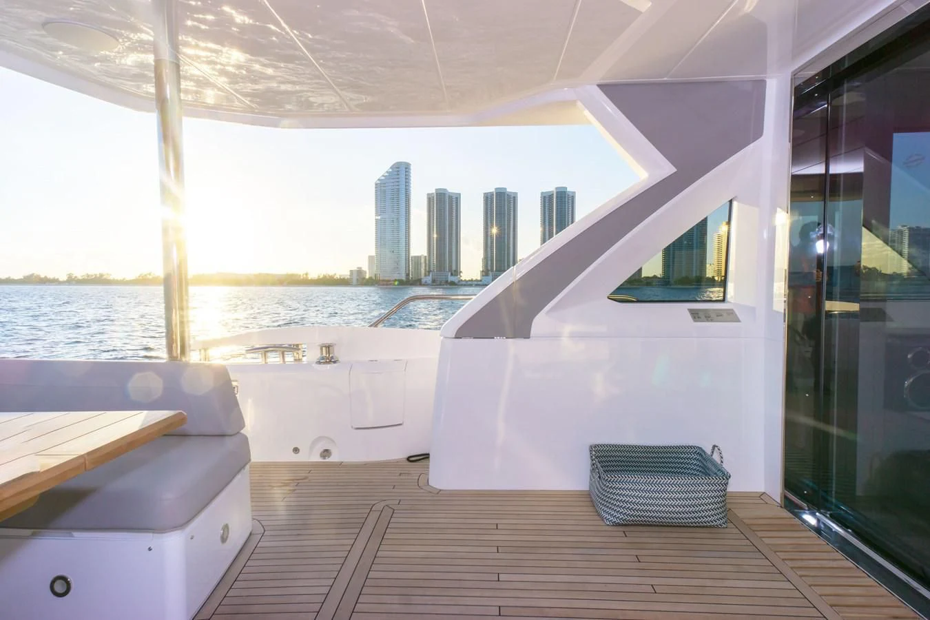a room with a view of a city and water aboard MILAMO Yacht for Sale