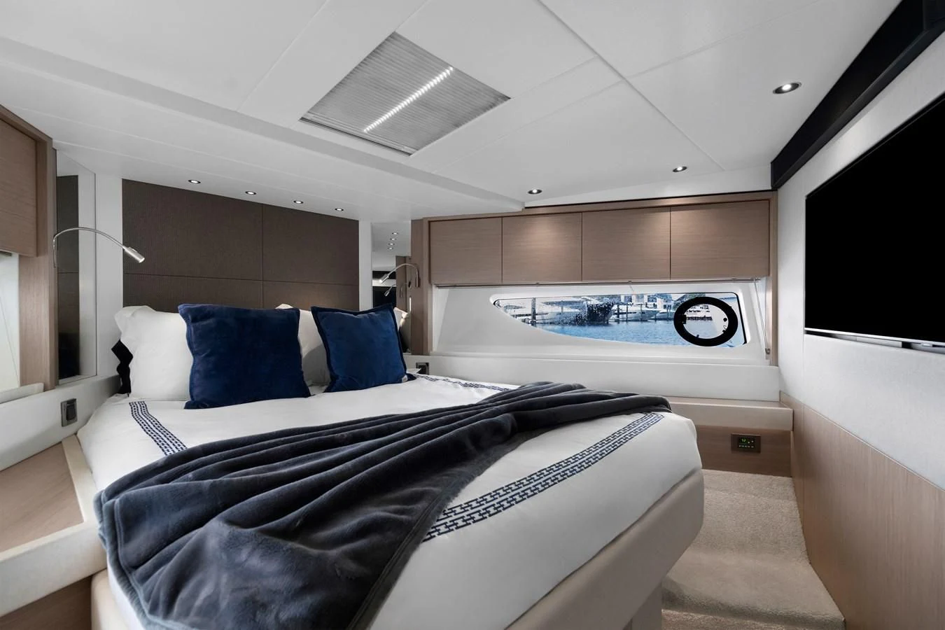 a large bed in a room aboard MILAMO Yacht for Sale