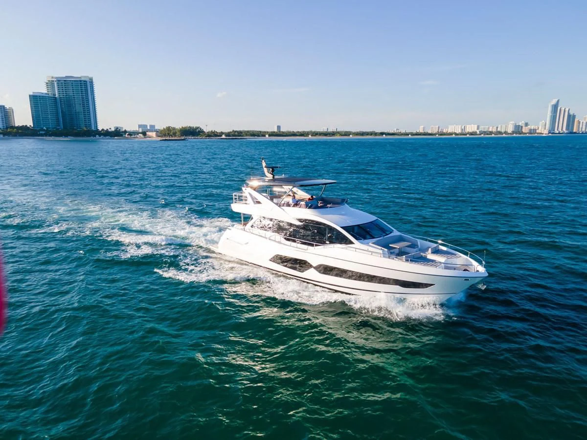 a white boat on the water aboard MILAMO Yacht for Sale