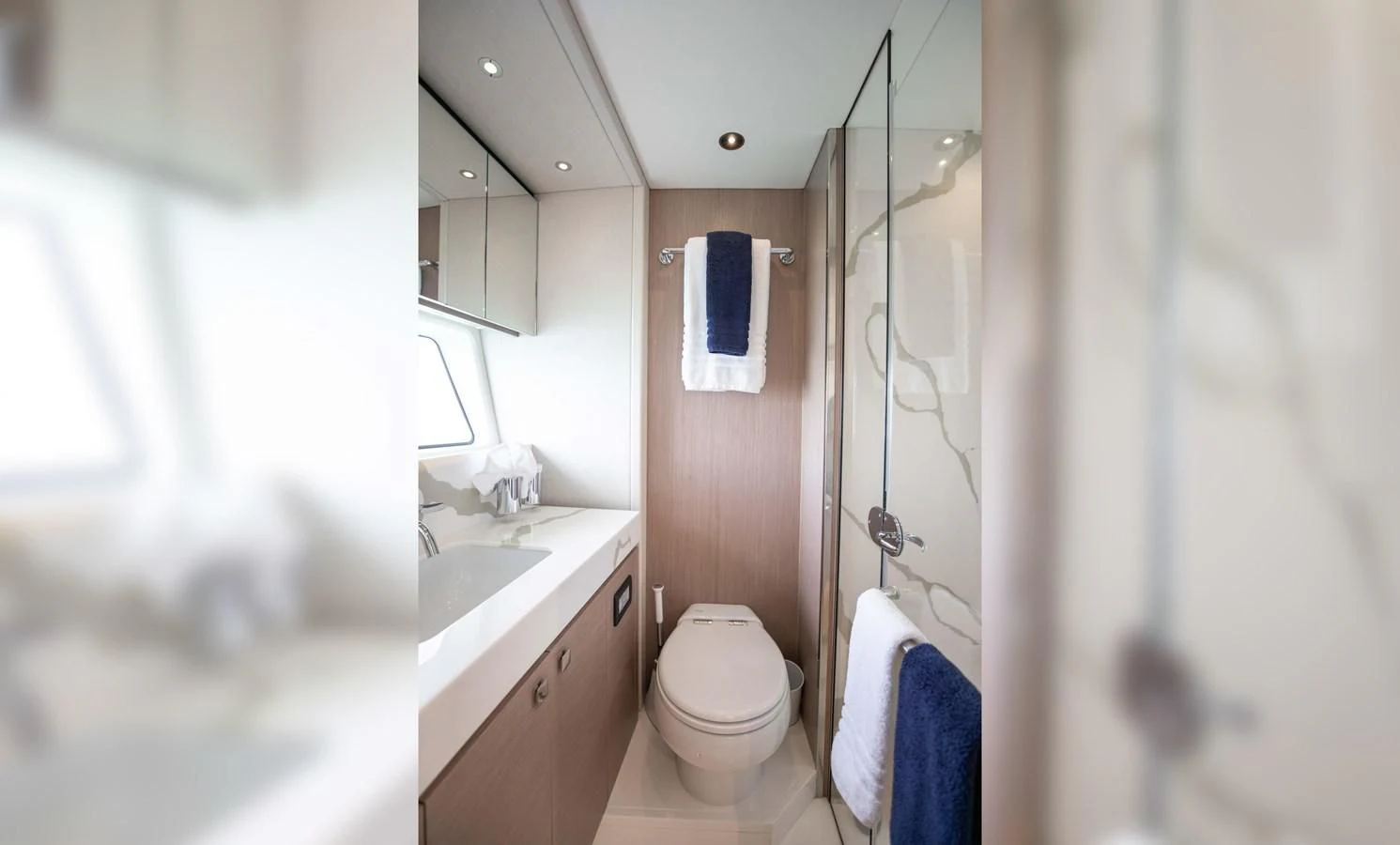a bathroom with a shower and sink aboard MILAMO Yacht for Sale