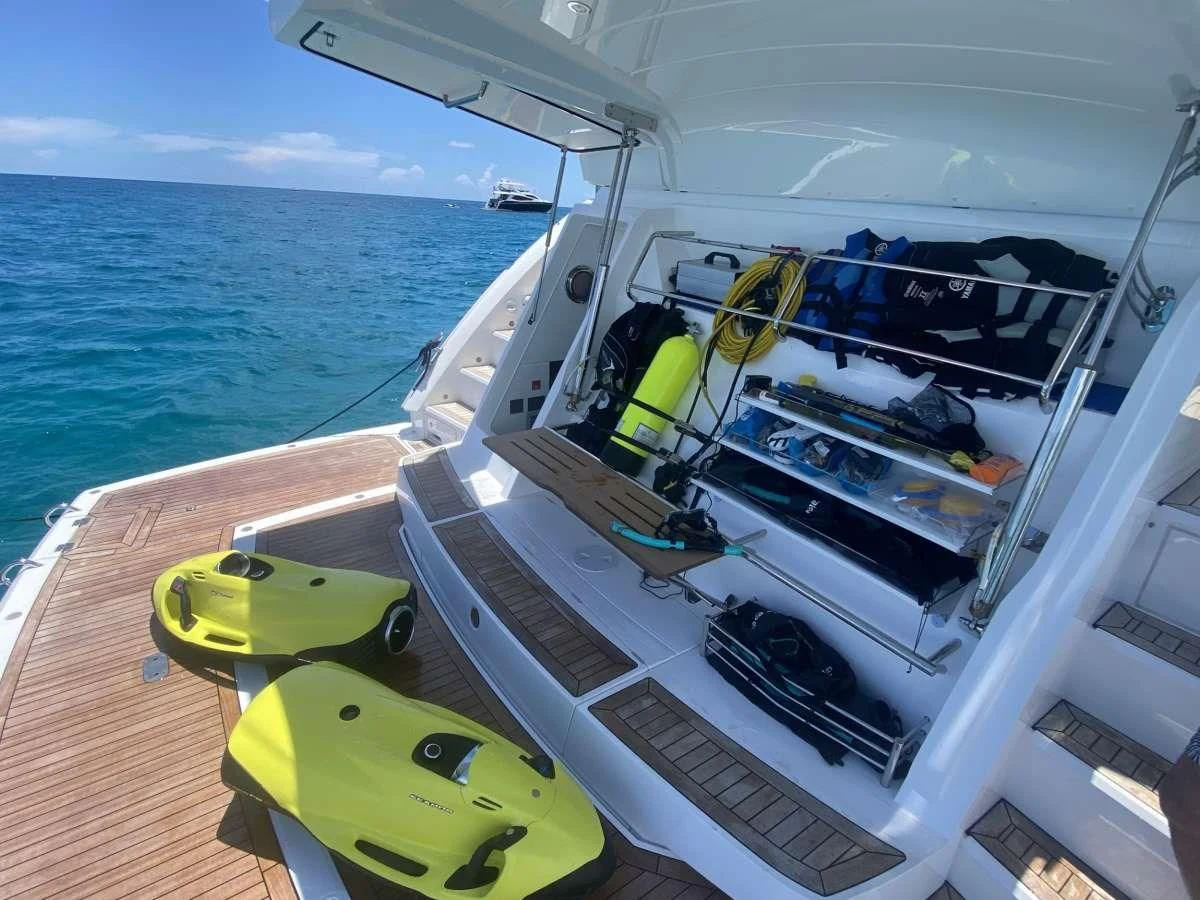 a boat with a green lawn chair on the deck aboard MILAMO Yacht for Sale