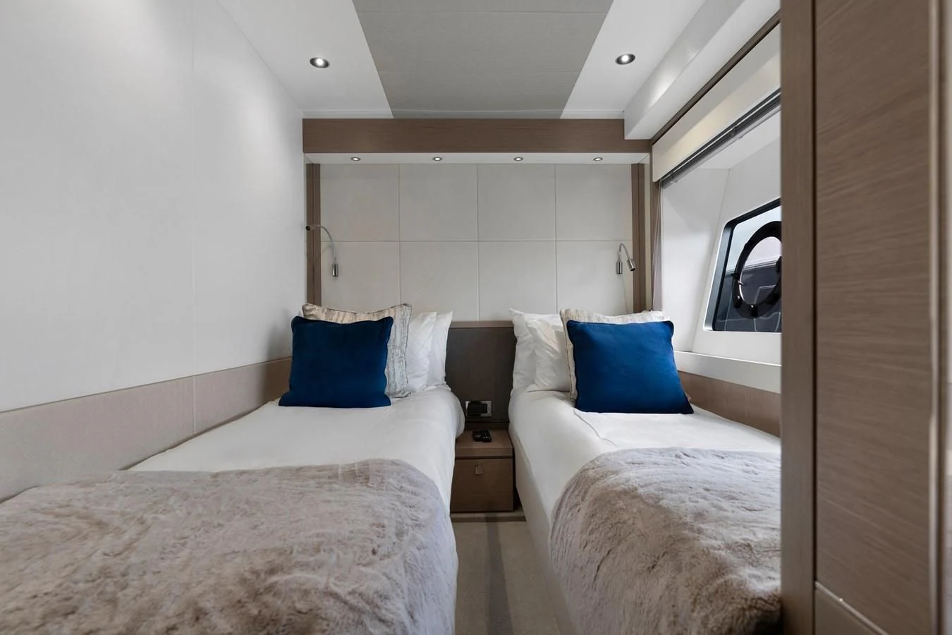 a room with two beds aboard MILAMO Yacht for Sale