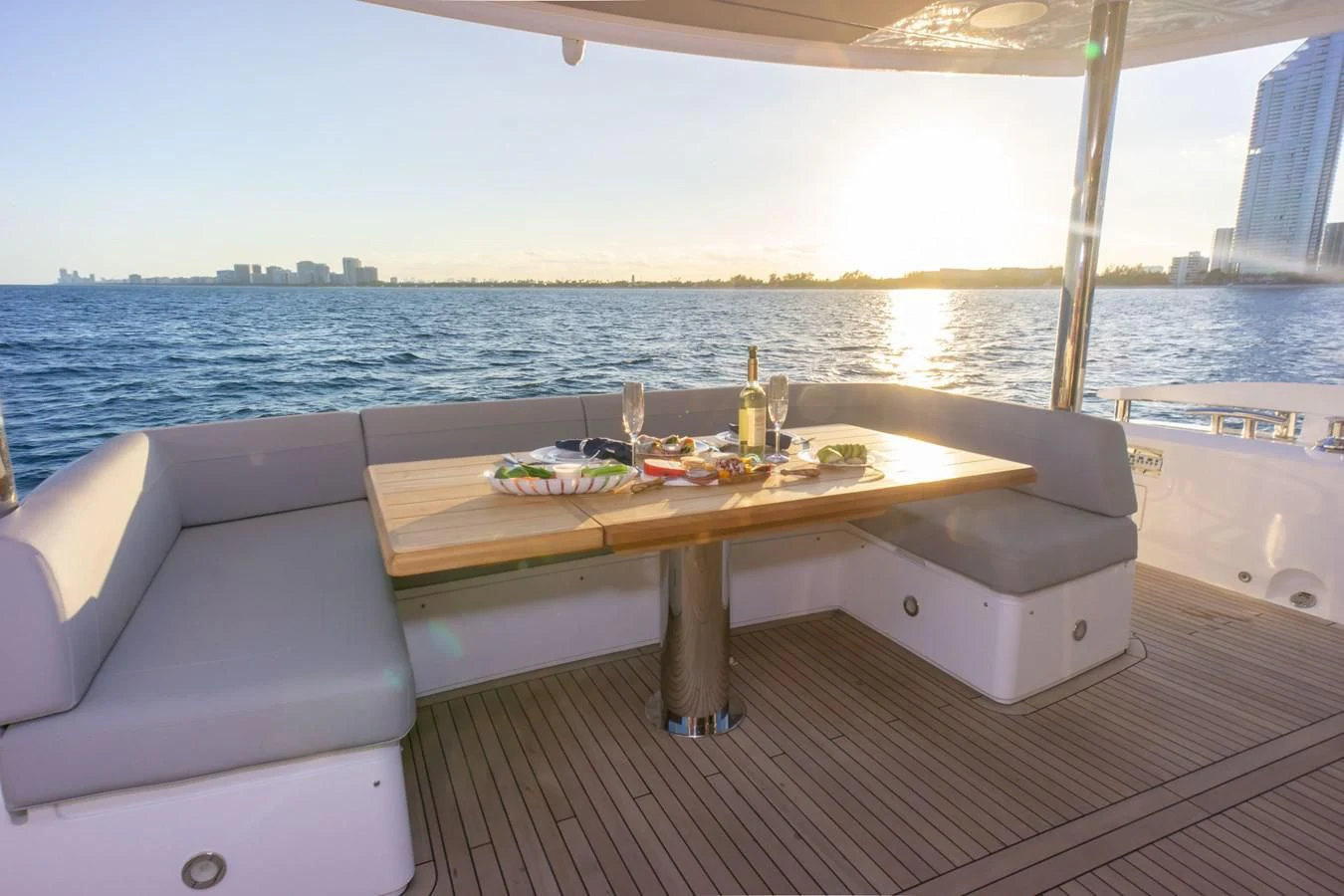 a table on a deck aboard MILAMO Yacht for Sale
