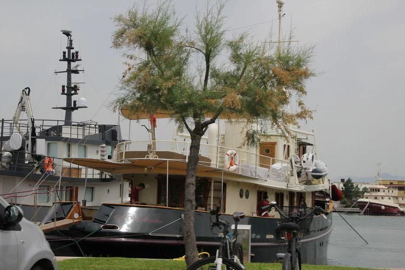 a boat docked at a pier aboard D.P. MONITOR Yacht for Sale