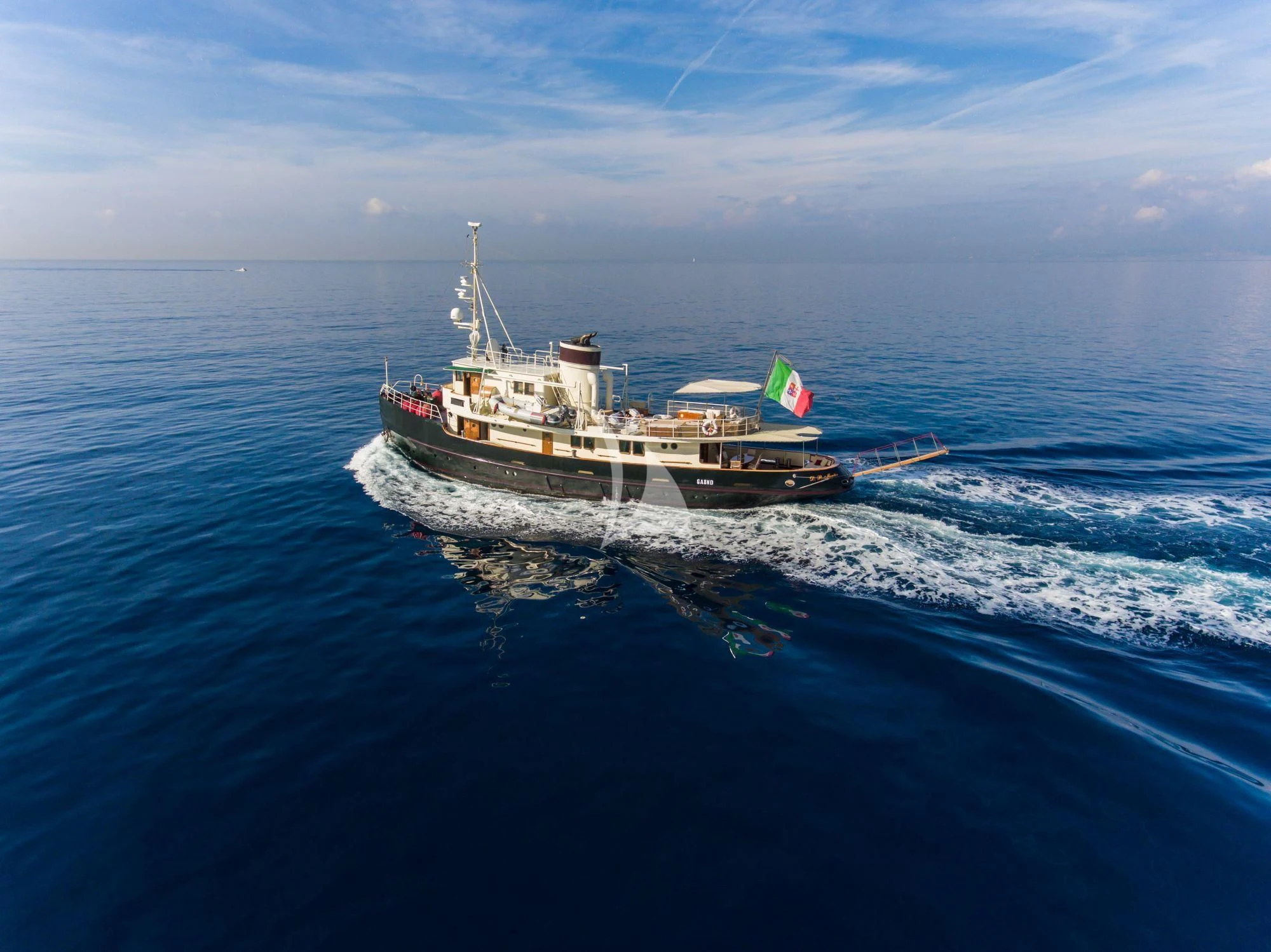 a boat in the water aboard D.P. MONITOR Yacht for Sale