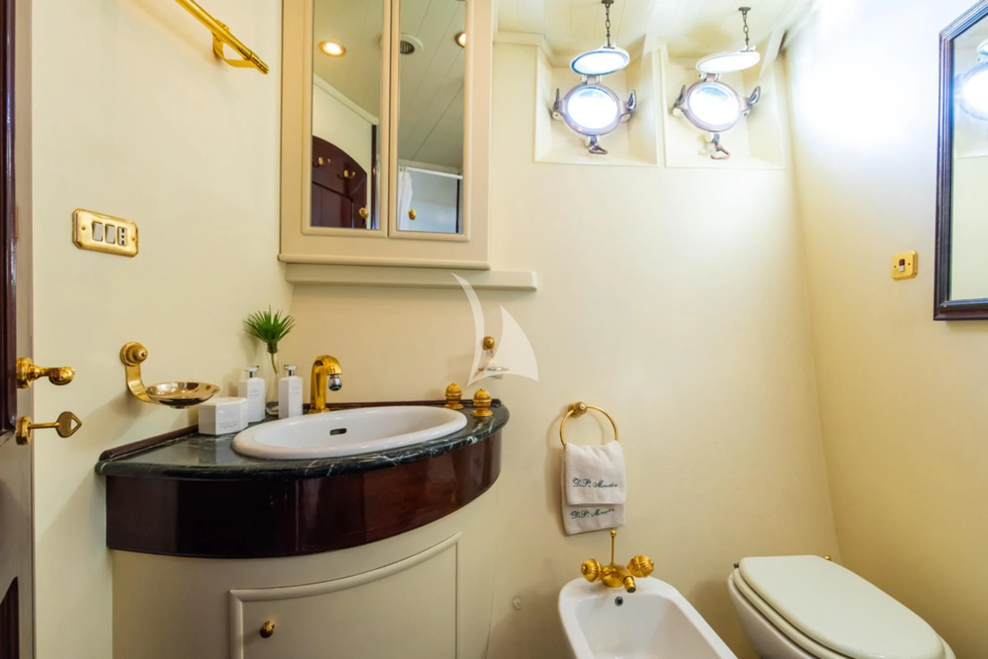 a bathroom with a sink and toilet aboard D.P. MONITOR Yacht for Sale