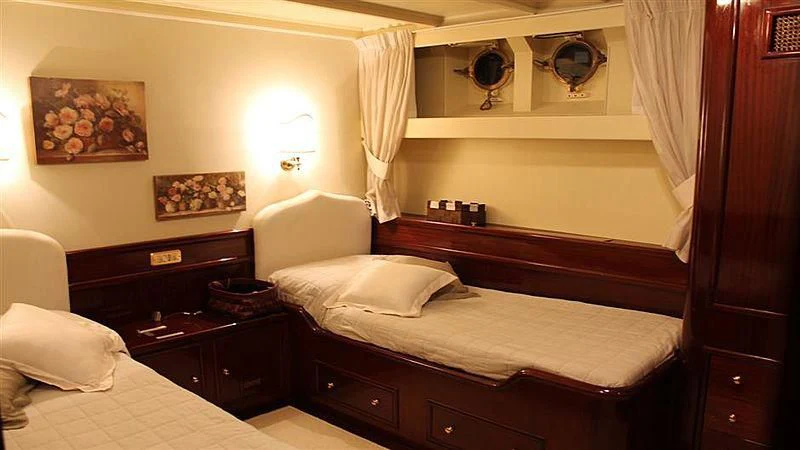 a room with two beds aboard D.P. MONITOR Yacht for Sale