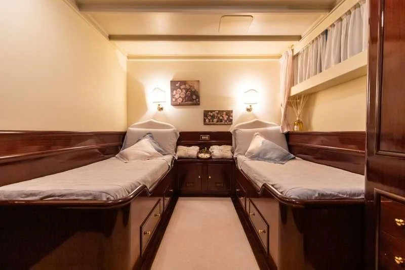 a room with two beds aboard D.P. MONITOR Yacht for Sale