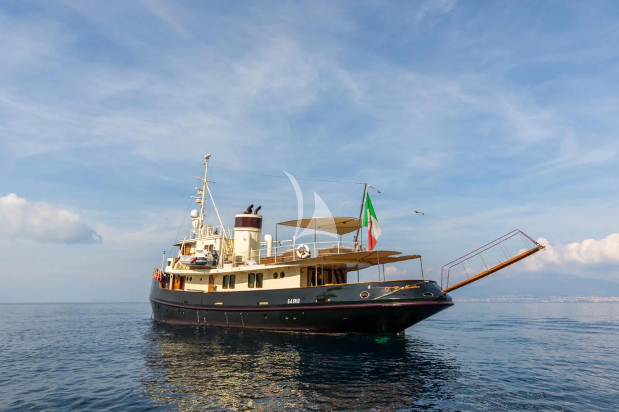 a boat on the water aboard D.P. MONITOR Yacht for Sale