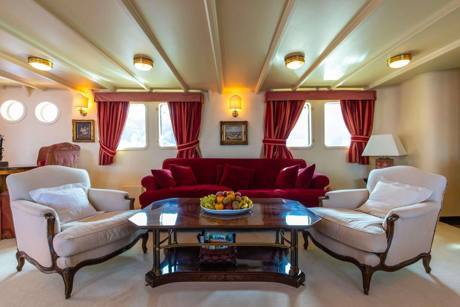 a living room with a table and chairs aboard D.P. MONITOR Yacht for Sale