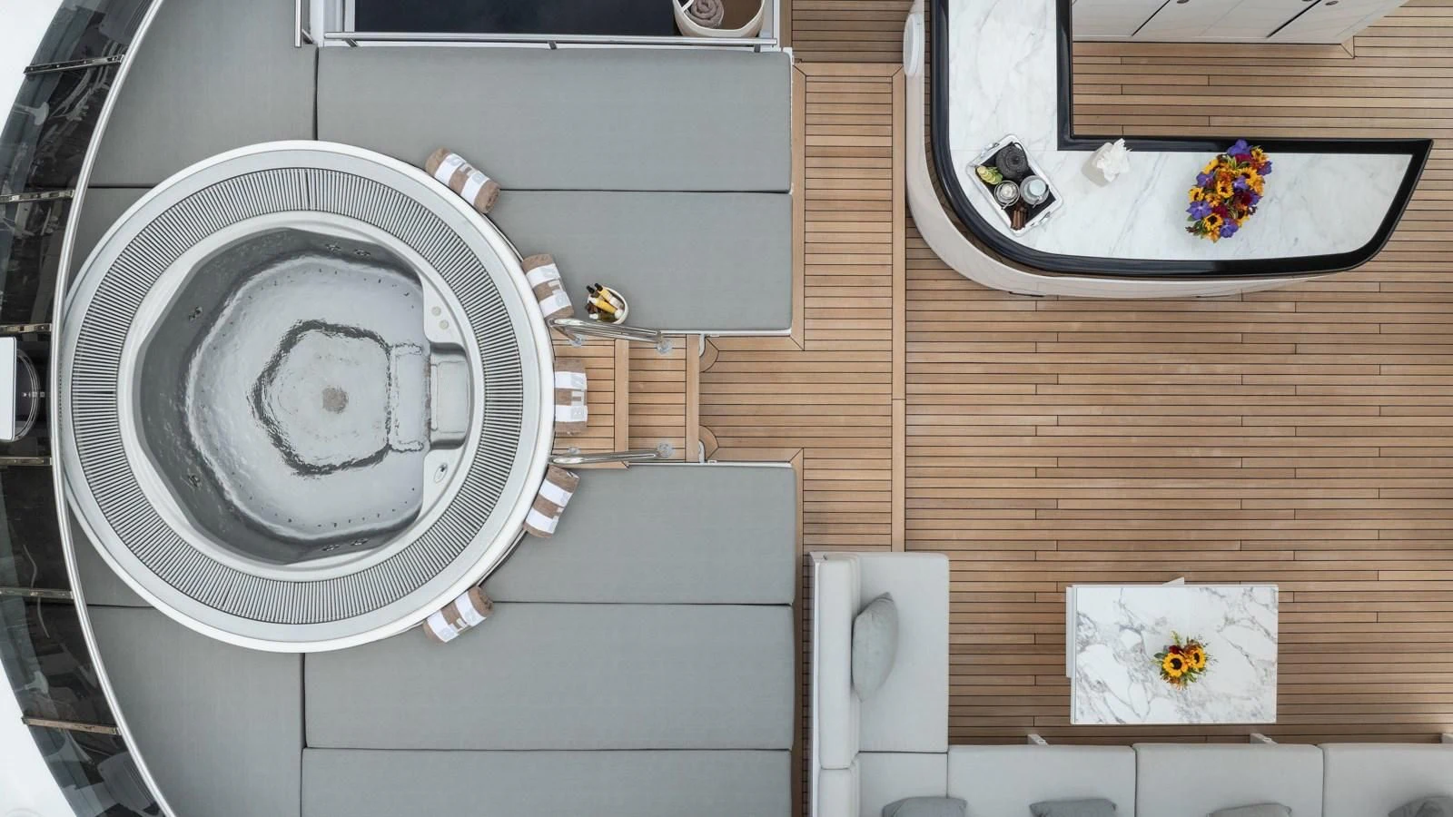 a bathroom with a round white washing machine aboard BLISS Yacht for Sale