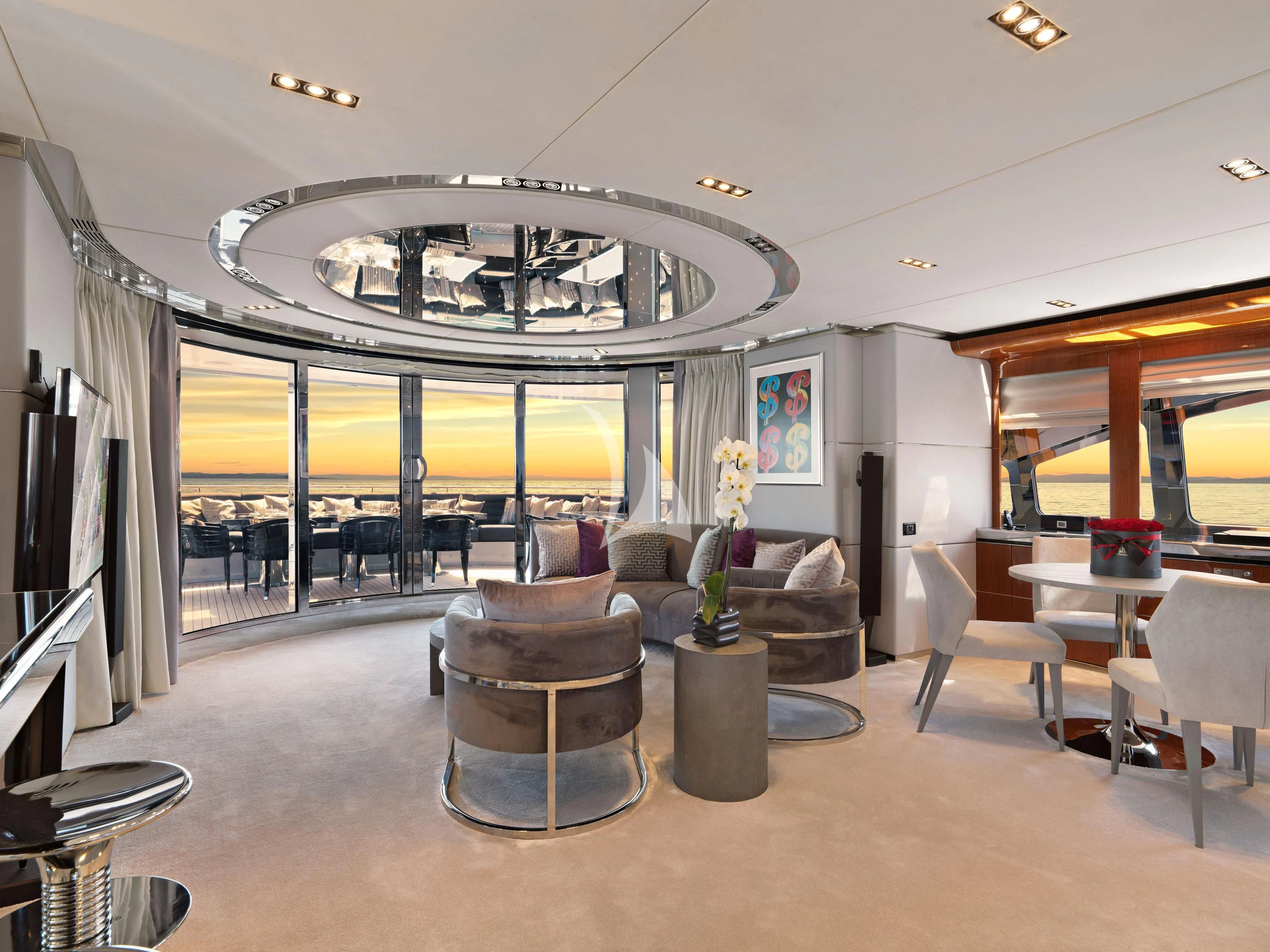 a large room with a chandelier aboard BLISS Yacht for Sale