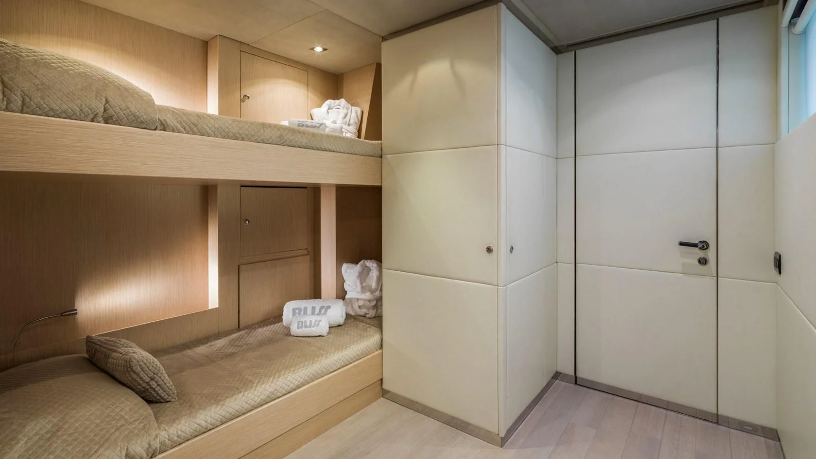 a room with a bed and a closet aboard BLISS Yacht for Sale