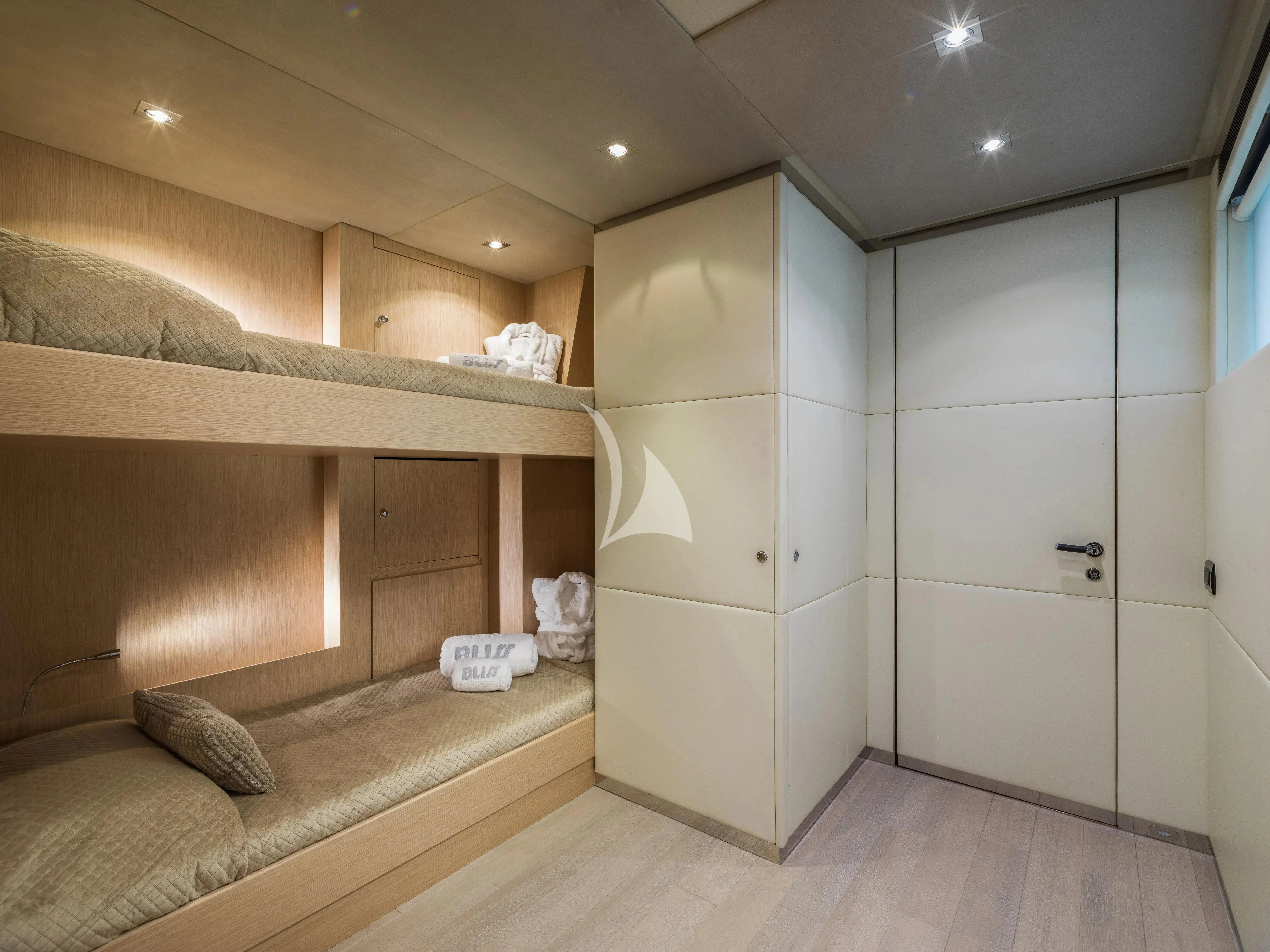 a room with a bed and a closet aboard BLISS Yacht for Sale
