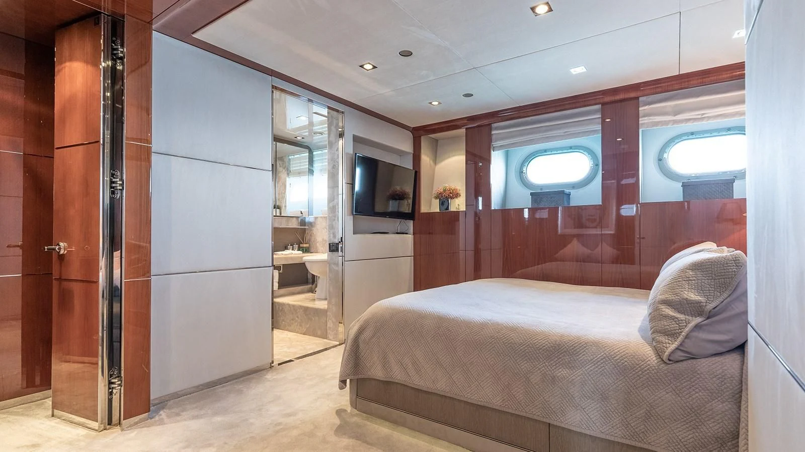 a room with a bed and a window aboard BLISS Yacht for Sale
