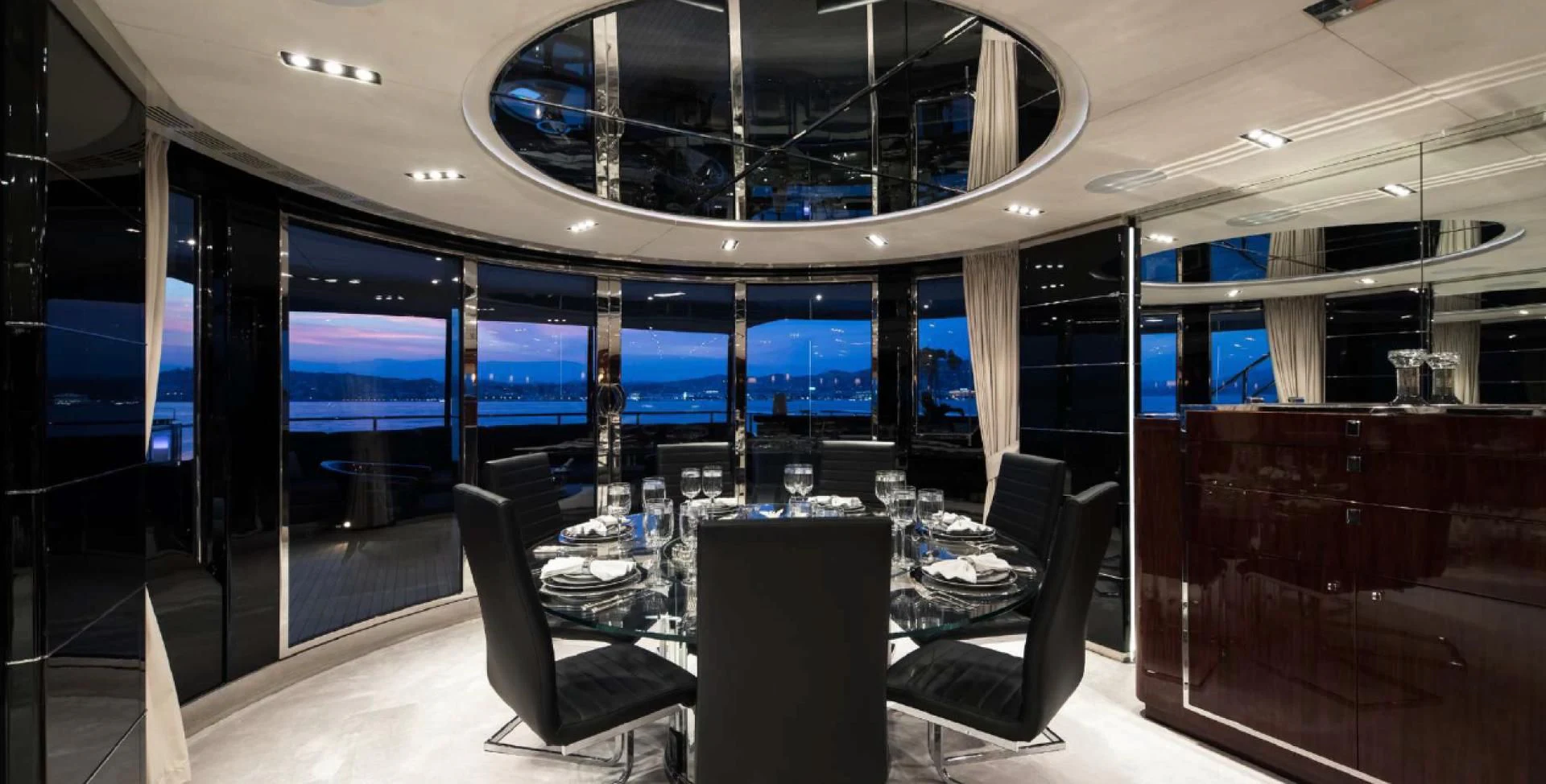 a room with a table and chairs aboard BLISS Yacht for Sale
