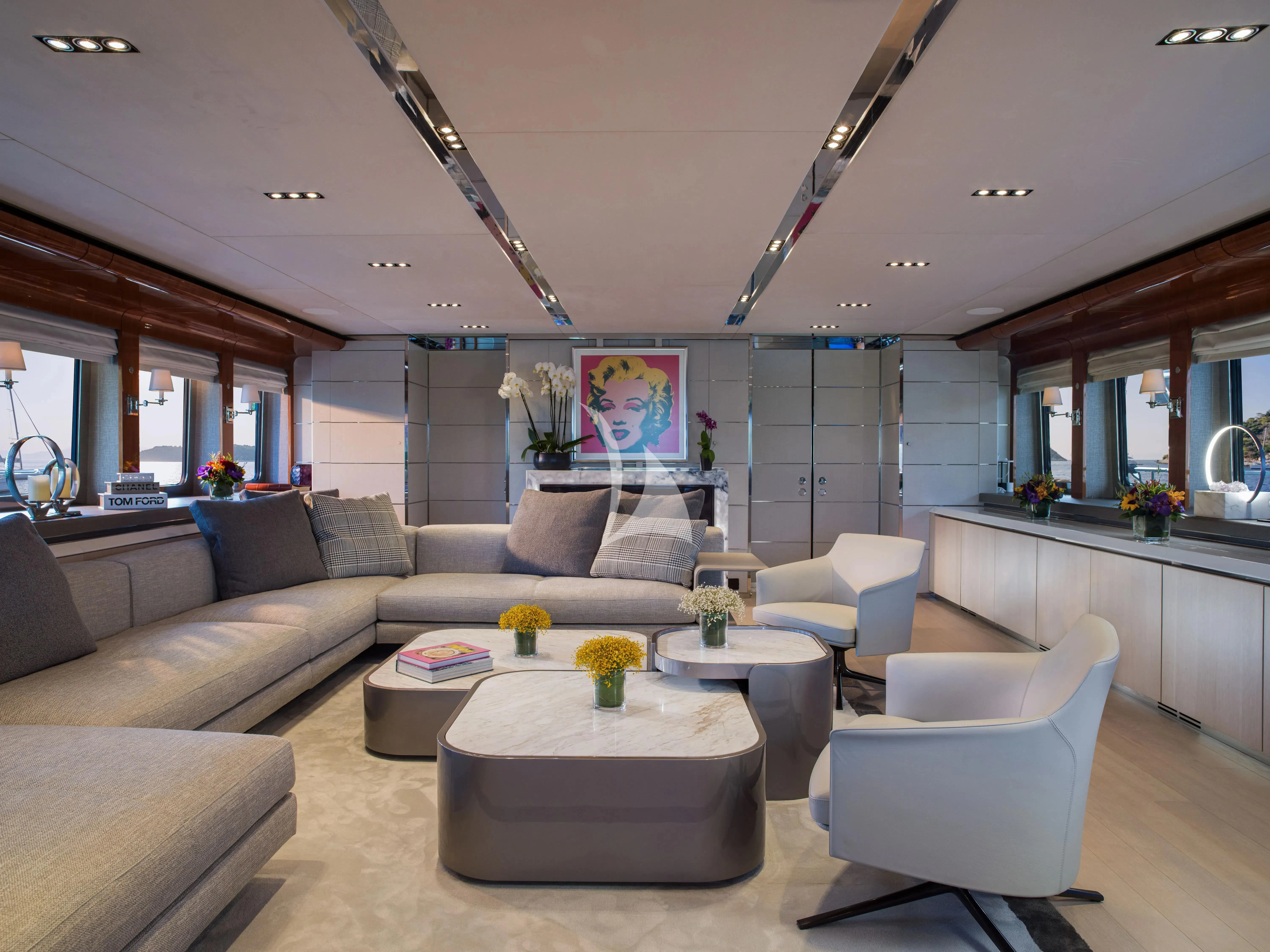 a living room with a couch and a table aboard BLISS Yacht for Sale