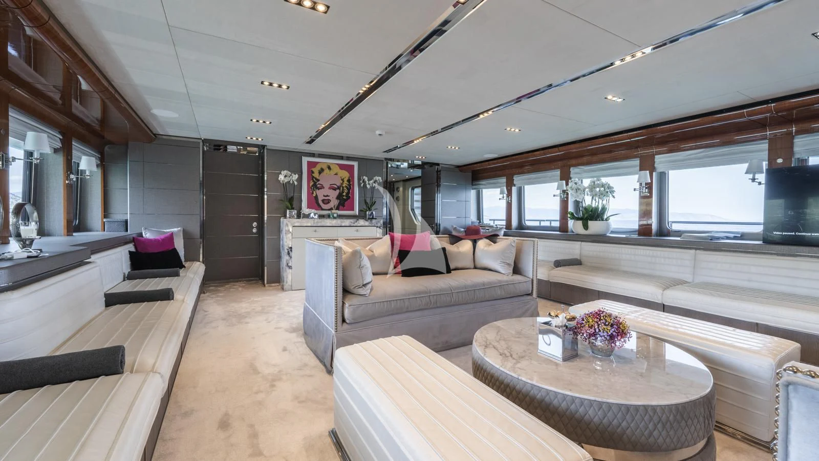 a living room with a couch and a table aboard BLISS Yacht for Sale