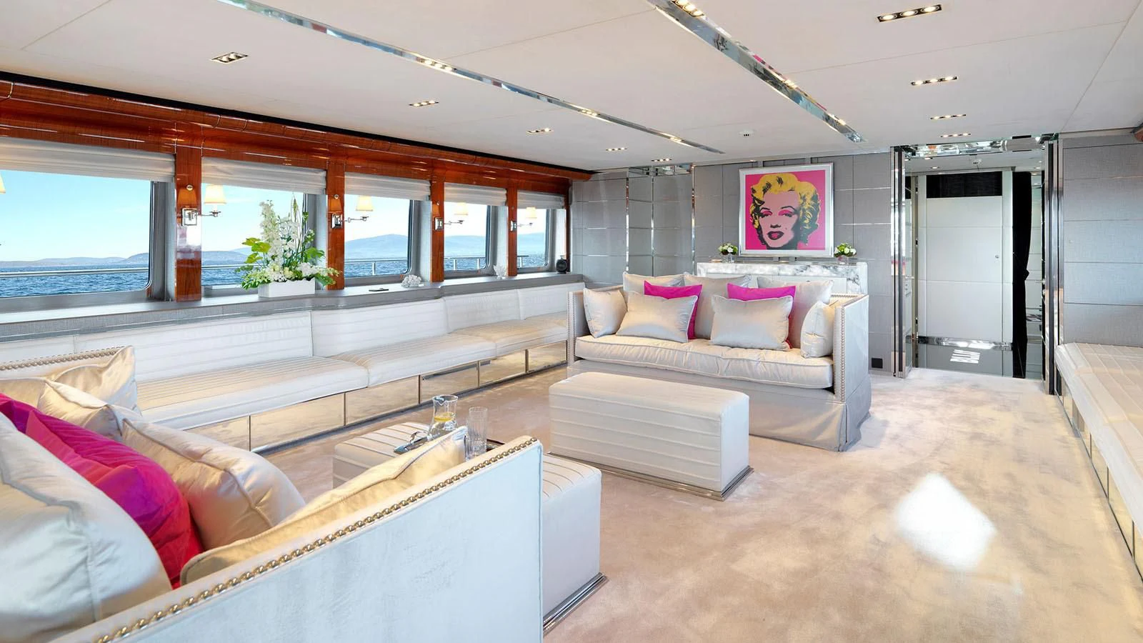 a living room with a couch and a table aboard BLISS Yacht for Sale