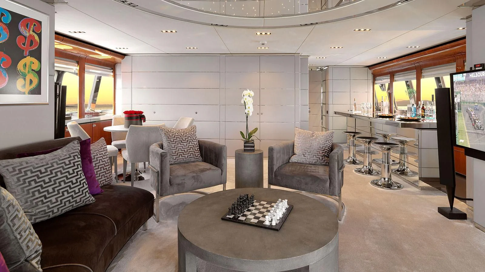 a living room with a table and chairs aboard BLISS Yacht for Sale