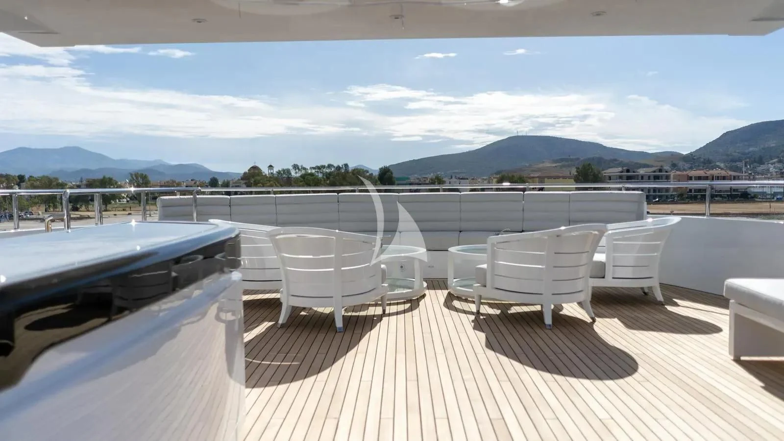 a deck with a table and chairs on it aboard BLISS Yacht for Sale