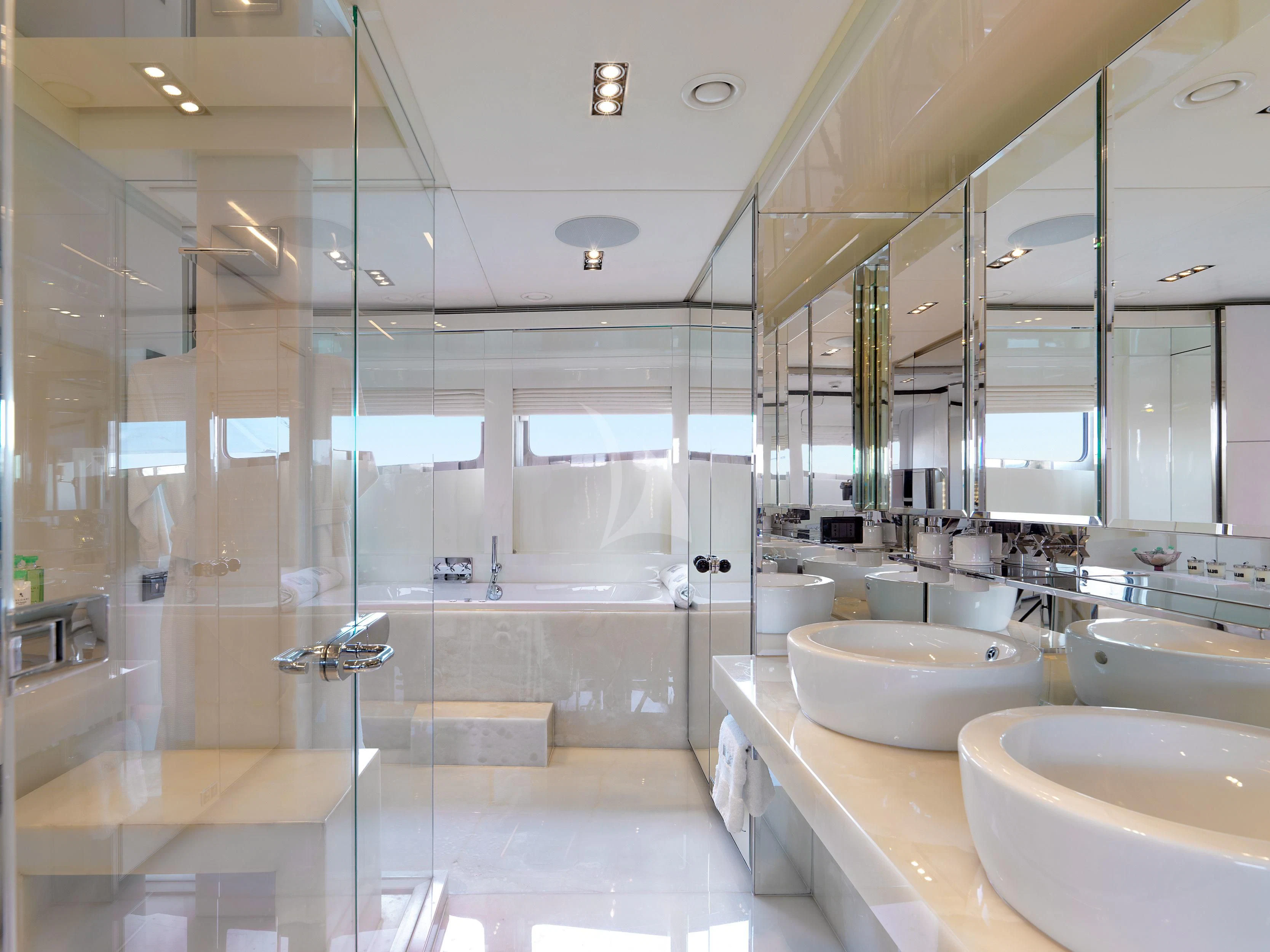 a bathroom with a glass shower aboard BLISS Yacht for Sale
