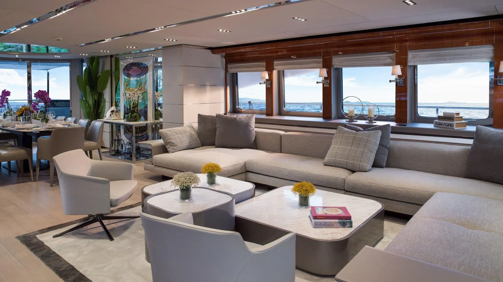 a living room with a couch and a table aboard BLISS Yacht for Sale