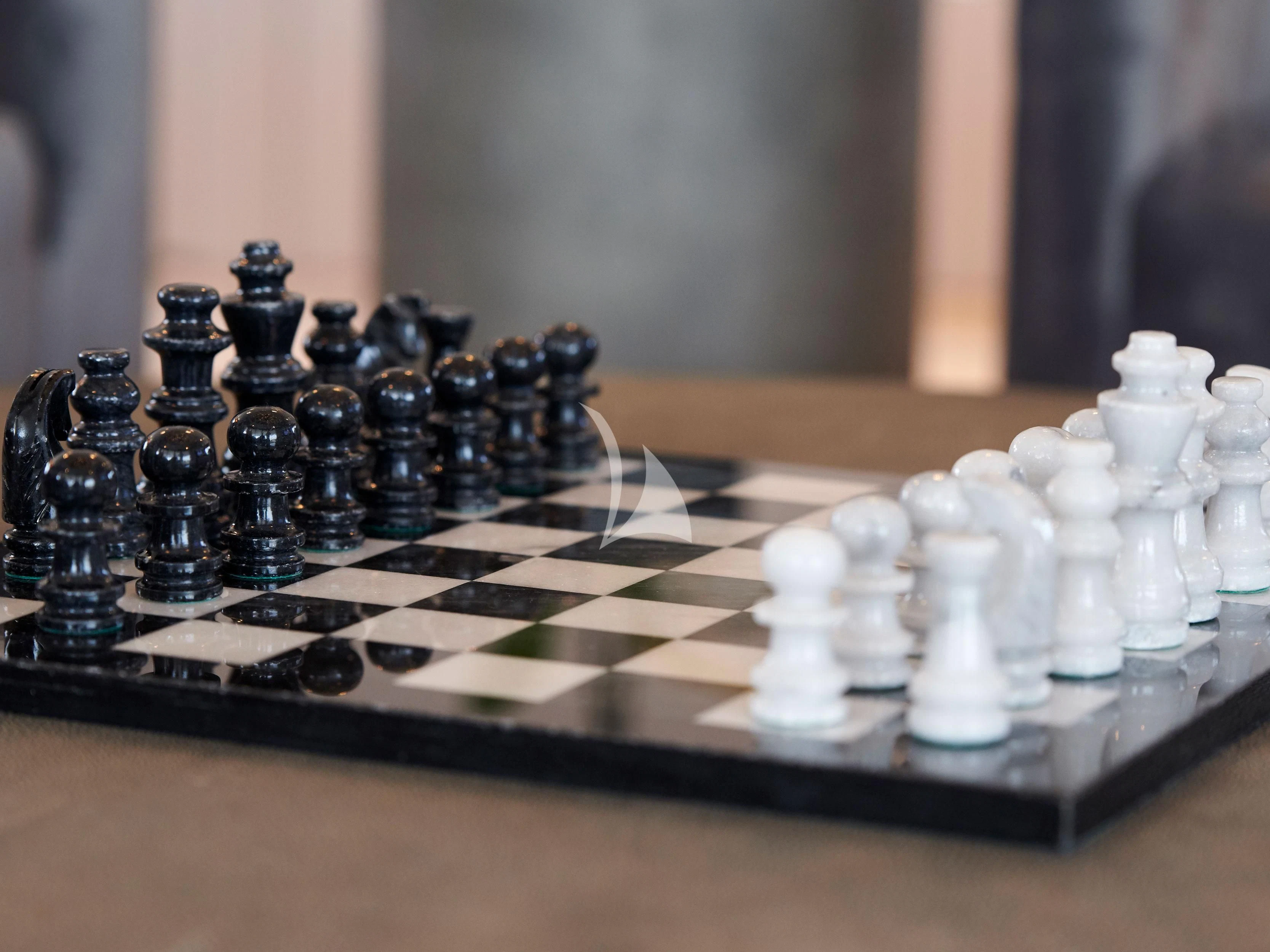 a chess board with a chess board aboard BLISS Yacht for Sale