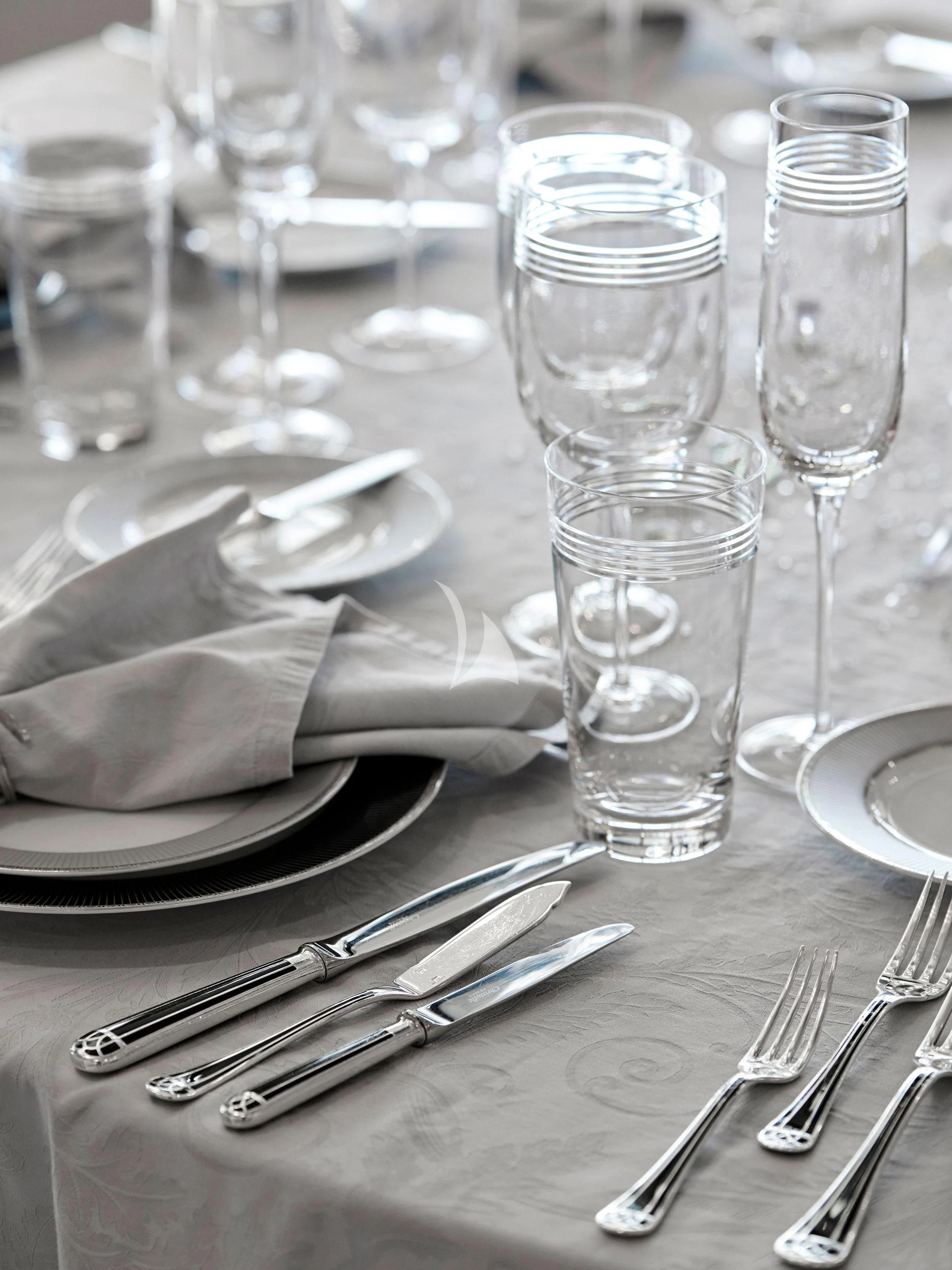 a table with plates and glasses aboard BLISS Yacht for Sale