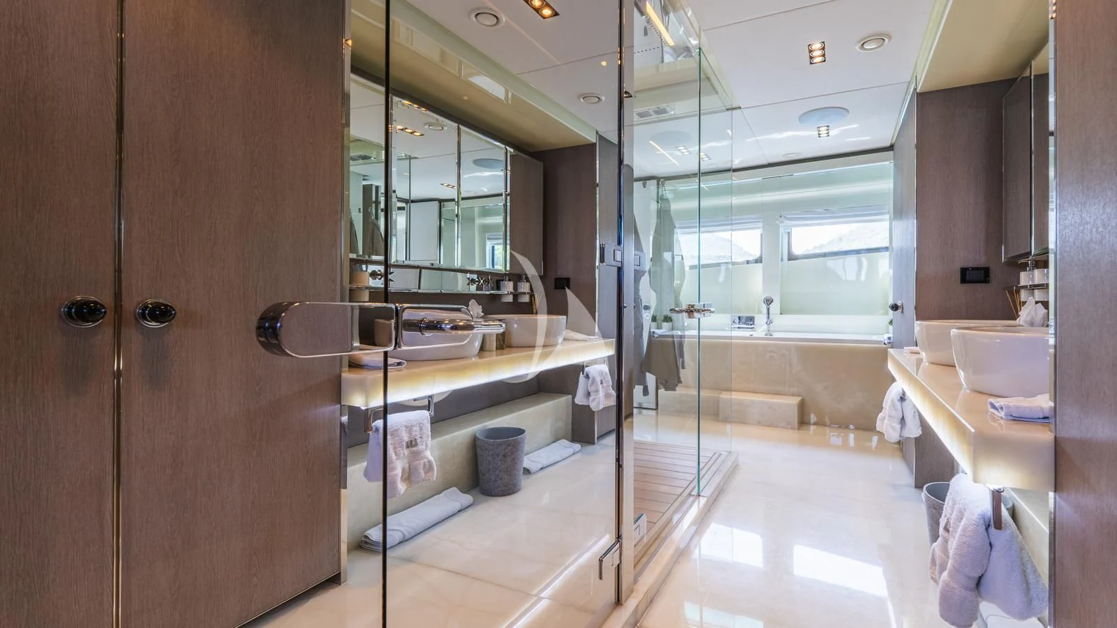 a bathroom with a glass shower aboard BLISS Yacht for Sale