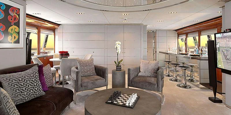 a living room with a table and chairs aboard BLISS Yacht for Sale